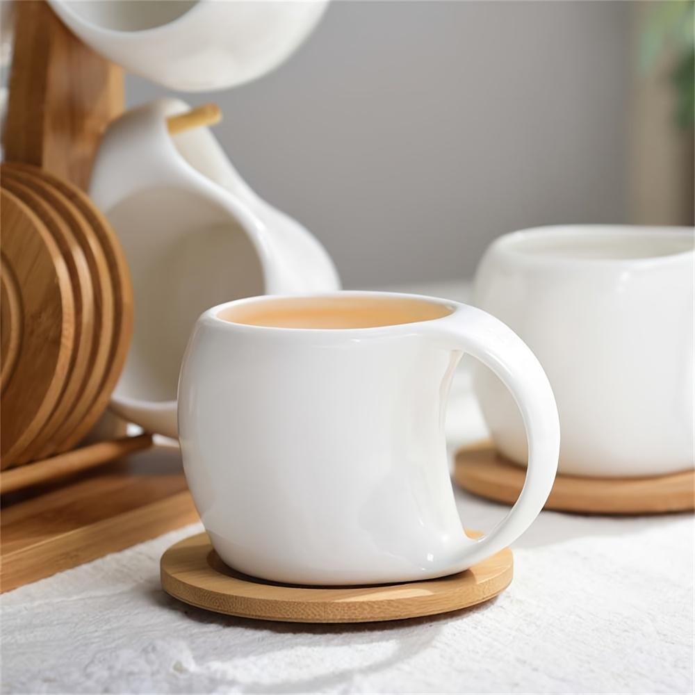 Faridabio 1 Set of Mug Stand And Coaster Set Includes a Ceramic Coffee Cup And Saucer, Perfect for Coffee Shops. This Set Features a Mug, a Coaster, And a Cup Holder, with Each Cup Holding 200Ml Or 7 Oz