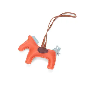 Versatile and fashionable bag charm in the shape of a little horse, in classic color schemes.